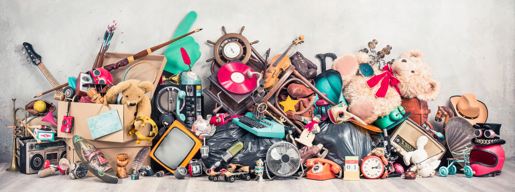 Old Antiques And Retro Collectibles Memorabilia Dumped In A Huge Pile. Garage Sale, Attic Room Storage Conceptual Still Life Or Disposal And Recycling Of Outdated Objects. Vintage Style Filtered Photo